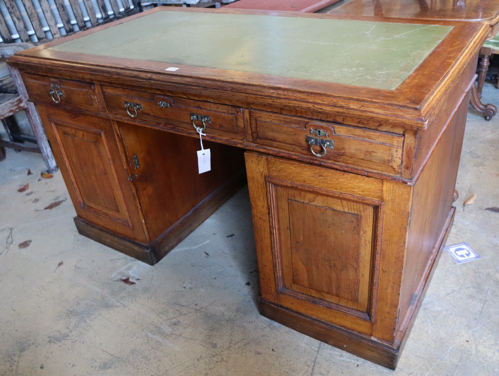 An early 20th century oak pedestal desk, width 136cm